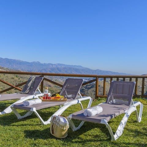 Flop down on a sun lounger with a good book and a cool drink