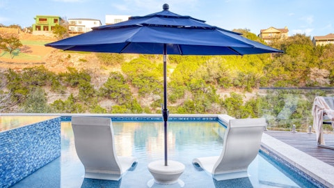 Lounge in the water with wooded hillside views stretching out