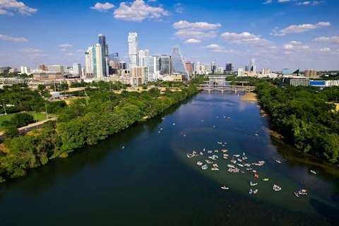Paddle or boat on Lake Austin's serene, tree-lined Colorado River reservoir, a thirty-two-minute drive
