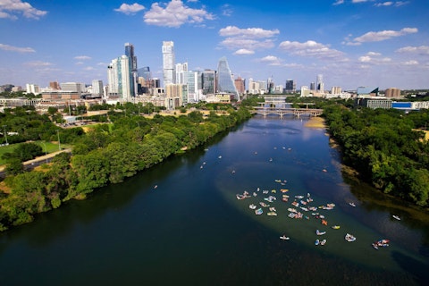 Paddle or boat on Lake Austin's serene, tree-lined Colorado River reservoir, a thirty-two-minute drive