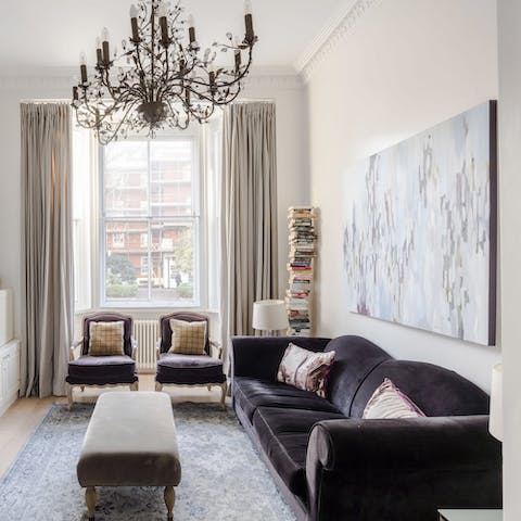 Relax in the elegant living area with a glass of wine after a day of exploring